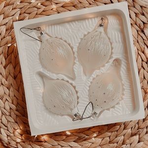 Set of 4 white and frosted vintage teardrop shape Christmas ornaments.